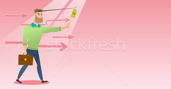 Businessman trying to catch money on fishing rod. Stock photo © RAStudio