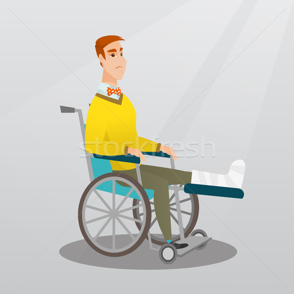 Man with broken leg sitting in a wheelchair. Stock photo © RAStudio