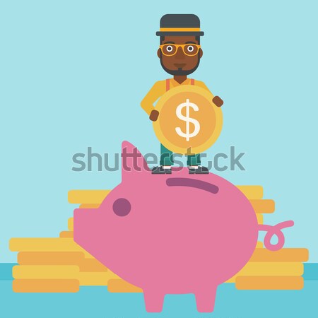 Business woman putting coin in piggy bank. Stock photo © RAStudio