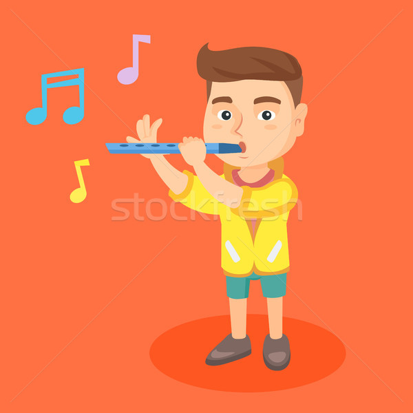 Stock photo: Caucasian little boy playing the flute.