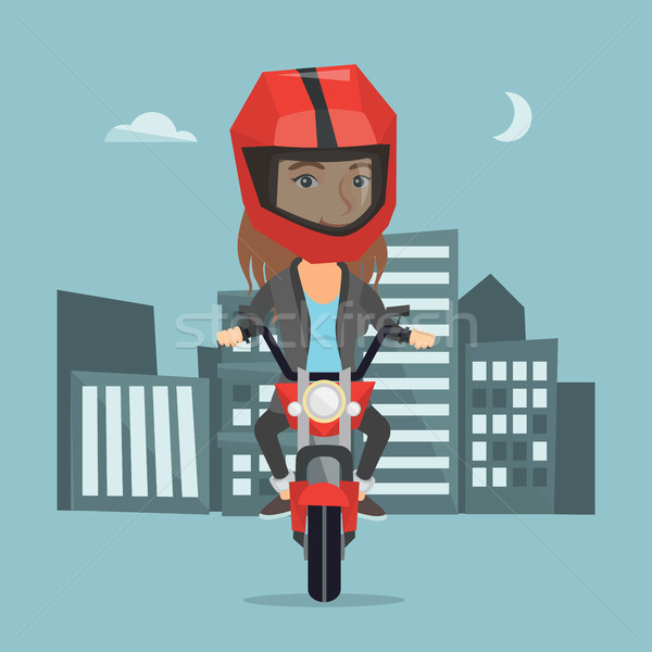 Stock photo: Caucasian woman riding a motorcycle at night.