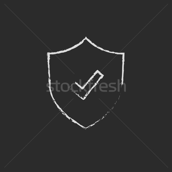 Shield with check mark icon drawn in chalk. Stock photo © RAStudio