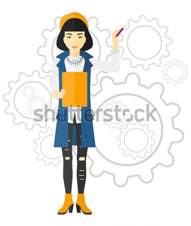 Woman standing on gears background. Stock photo © RAStudio
