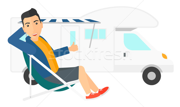 Man sitting in front of motorhome. Stock photo © RAStudio