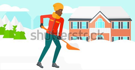 Woman shoveling and removing snow. Stock photo © RAStudio