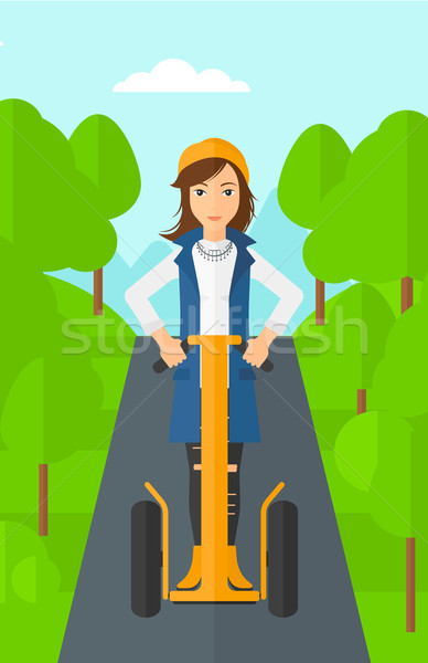 Woman riding on electric scooter. Stock photo © RAStudio