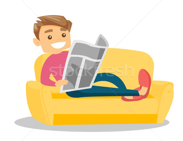 Man laying on the couch and reading a newspaper. Stock photo © RAStudio