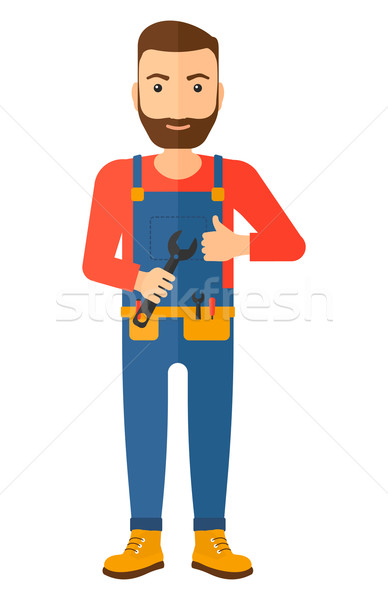 Cheerful repairman with spanner. Stock photo © RAStudio