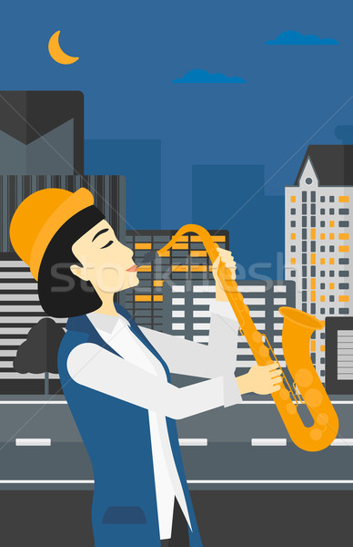 Femme jouer saxophone asian musicien nuit [[stock_photo]] © RAStudio