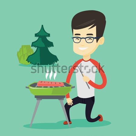 Man cooking steak on barbecue grill. Stock photo © RAStudio