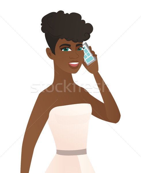 Young african fiancee talking on a mobile phone. Stock photo © RAStudio