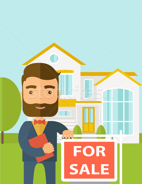Real estate agent standing beside the for sale placard. Stock photo © RAStudio