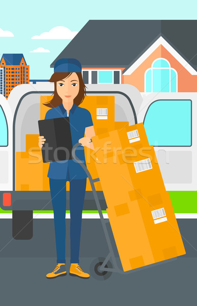 Woman delivering boxes. Stock photo © RAStudio