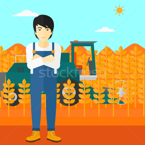 Man standing with combine on background. Stock photo © RAStudio