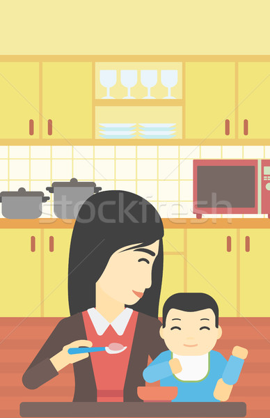 Mother feeding baby. Stock photo © RAStudio