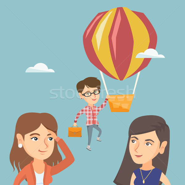 Hardworking employee flying away on a balloon. Stock photo © RAStudio