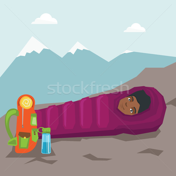 Woman sleeping in a sleeping bag in the mountains. Stock photo © RAStudio