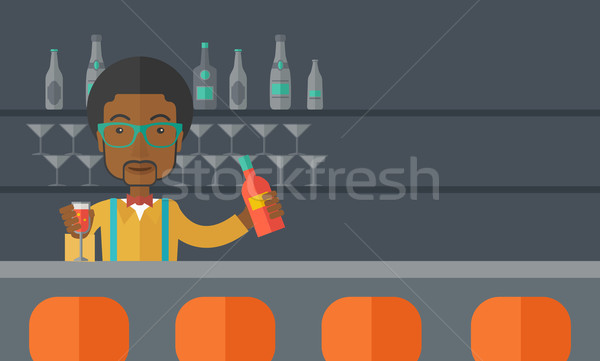 African bartender at the bar holding a drinks. Stock photo © RAStudio