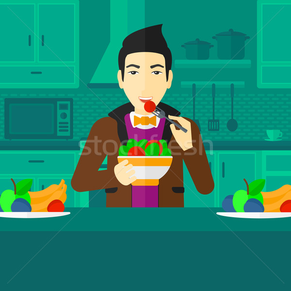 Man eating salad. Stock photo © RAStudio