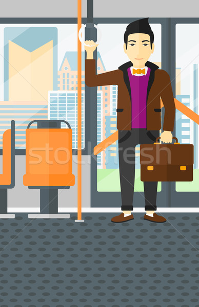 Człowiek stałego wewnątrz transport publiczny asian walizkę Zdjęcia stock © RAStudio