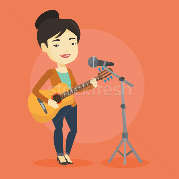 Foto stock: Mujer · cantando · micrófono · jugando · guitarra · Asia