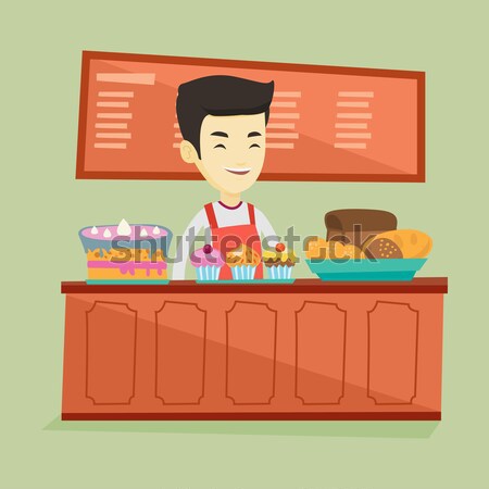 Worker standing behind the counter at the bakery. Stock photo © RAStudio