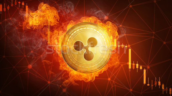 Stock photo: Golden Ripple coin falling in fire flame.