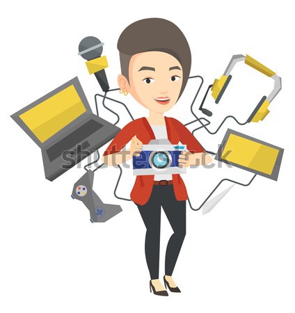 Young woman surrounded with her gadgets. Stock photo © RAStudio