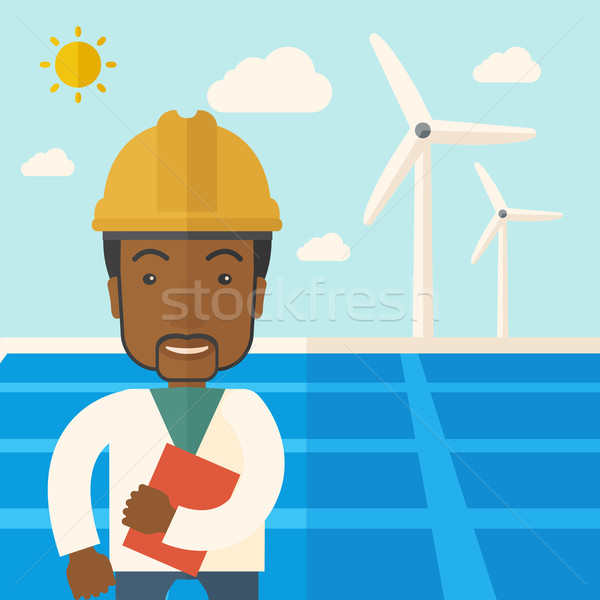 Black man in solar panel and windmills. Stock photo © RAStudio