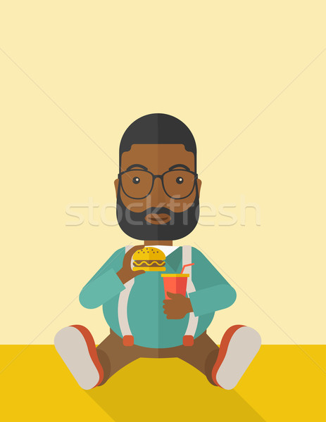 Man eating hamburger.  Stock photo © RAStudio