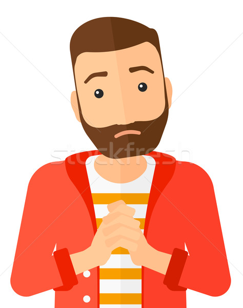 Regretful man with clasped hands. Stock photo © RAStudio