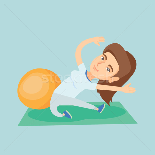 Young caucasian woman exercising with fitball. Stock photo © RAStudio