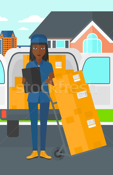 Woman delivering boxes. Stock photo © RAStudio