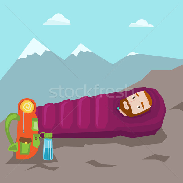 Man sleeping in sleeping bag in the mountains. Stock photo © RAStudio