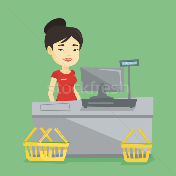 Cashier standing at the checkout in supermarket. Stock photo © RAStudio