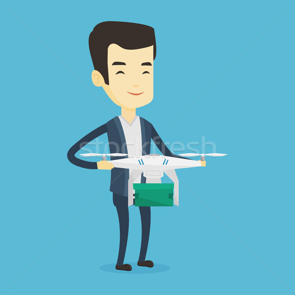 Man controlling delivery drone with post package Stock photo © RAStudio