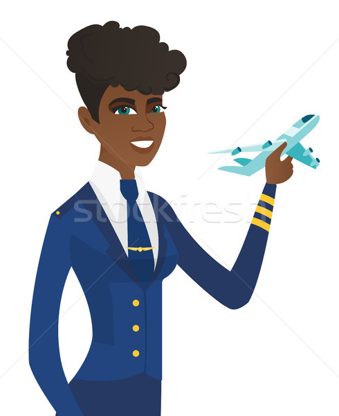 Young african stewardess with model of airplane. Stock photo © RAStudio