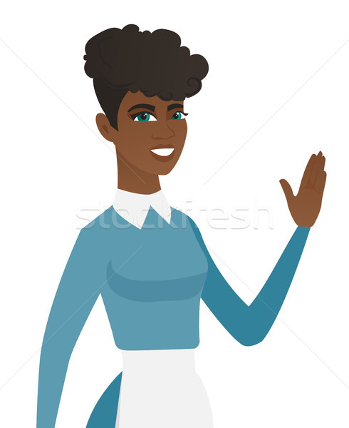 Stock photo: Young african-american cleaner waving her hand.