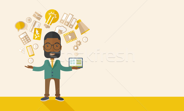 Happy Black man enjoying doing multitasking. Stock photo © RAStudio