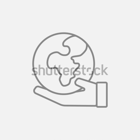 Hand holding the Earth line icon. Stock photo © RAStudio