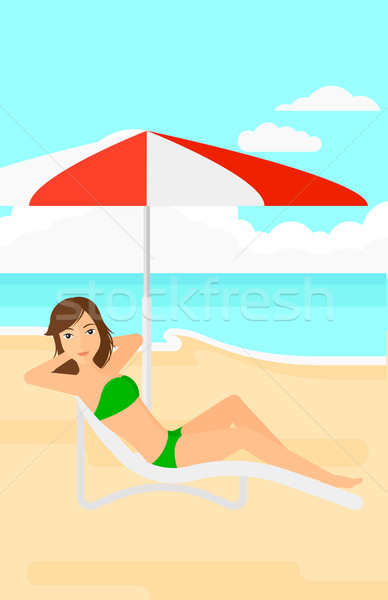 Stock photo: Woman sitting in chaise longue.