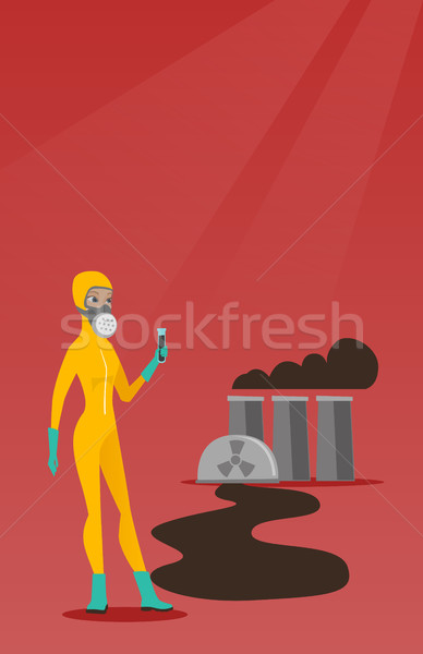 Woman in radiation protective suit with test tube. Stock photo © RAStudio