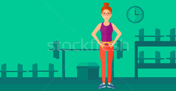 Woman measuring waist. Stock photo © RAStudio