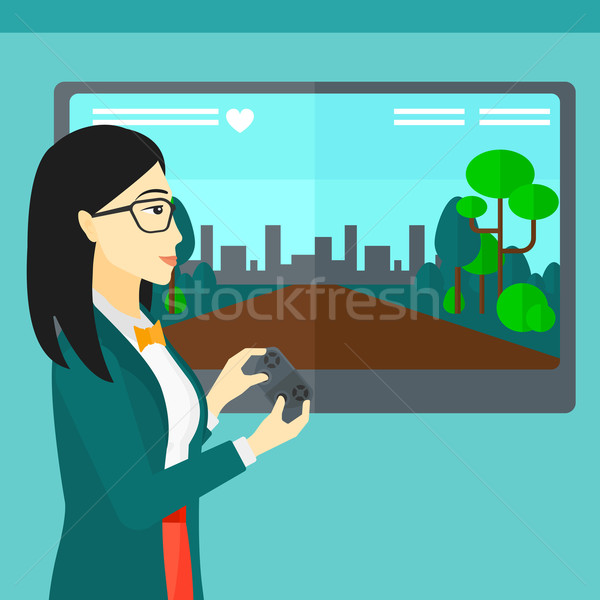 Woman playing video game. Stock photo © RAStudio