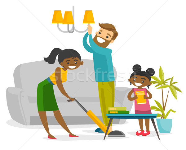 Young happy multiracial family cleaning house. Stock photo © RAStudio