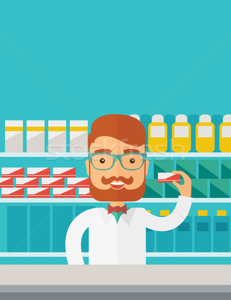 Young  pharmacy chemist man standing in drugstore.  Stock photo © RAStudio