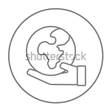 Hand holding the Earth line icon. Stock photo © RAStudio