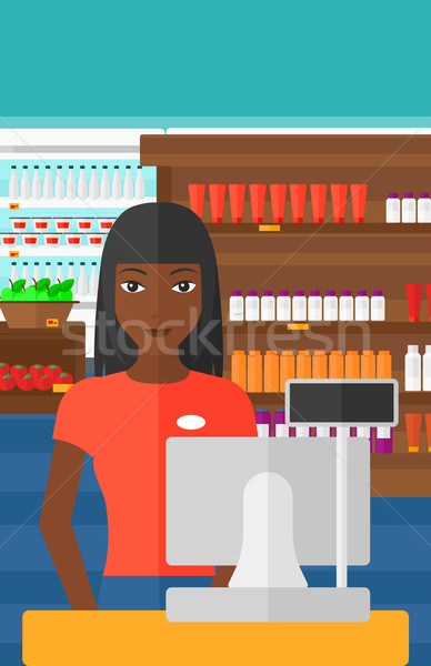 Saleslady standing at checkout. Stock photo © RAStudio
