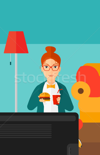 Woman eating hamburger.  Stock photo © RAStudio