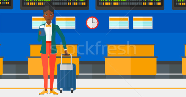 Femeie în picioare valiză bilet paşaport Imagine de stoc © RAStudio